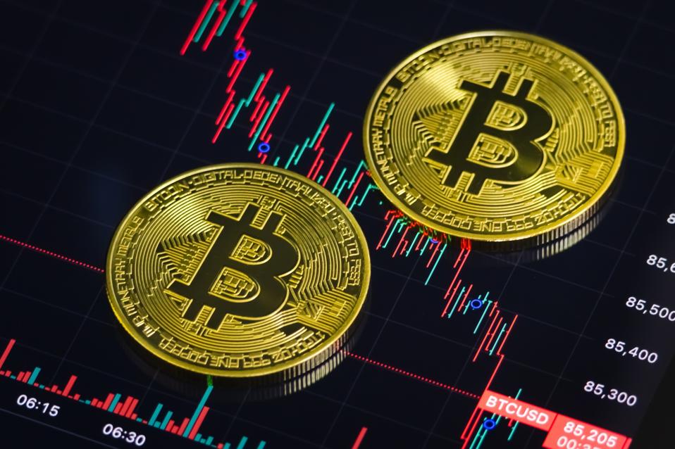 Bitcoin Coins And Price Chart Showing Market Downturn