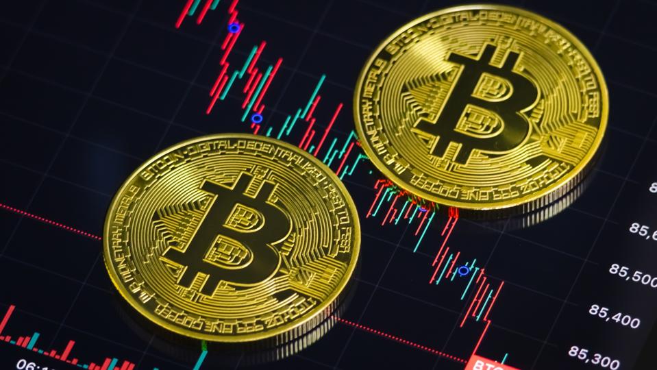 Bitcoin Coins And Price Chart Showing Market Downturn