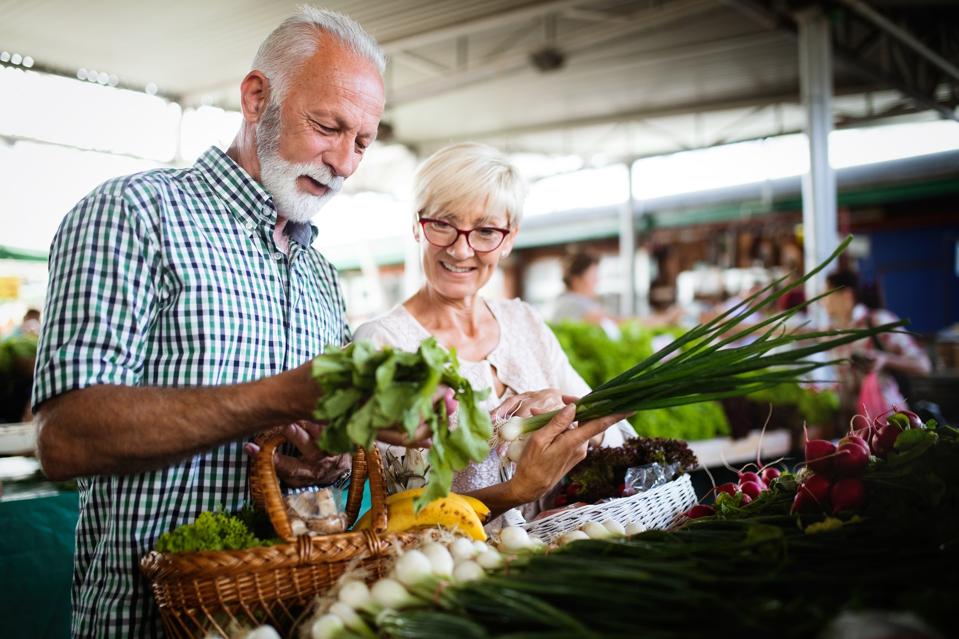 Retirement couple shopping for groceries