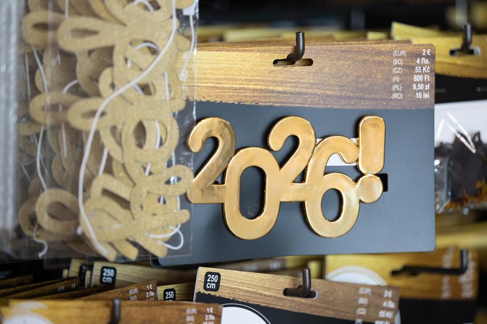 Decorative items with the inscription '2026' hanging on a wall.
