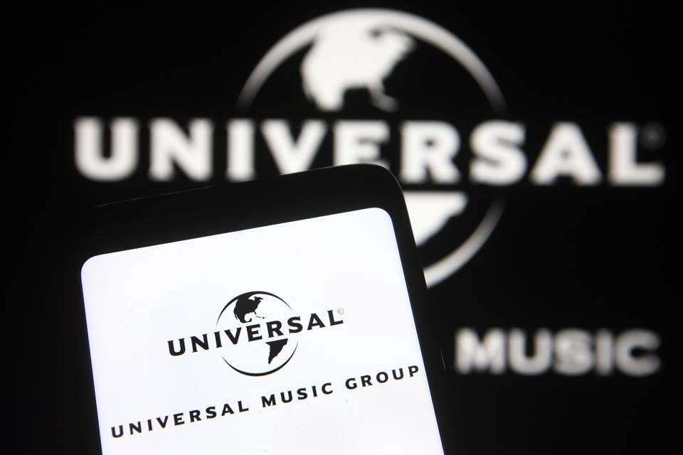 In this photo illustration, Universal Music Group (UMG) logo...