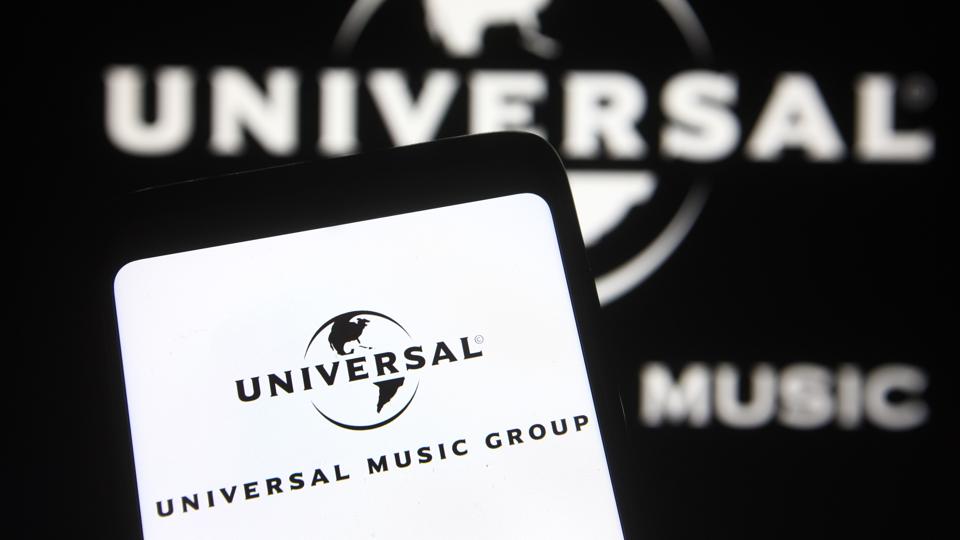 In this photo illustration, Universal Music Group (UMG) logo...