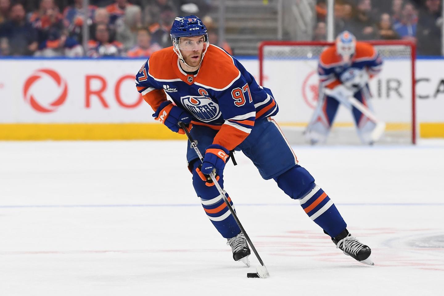 Edmonton Oilers center Connor McDavid with the puck in a 2025 game against the Canucks.
