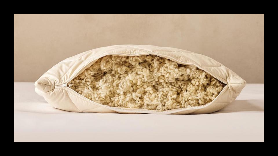 A Woolroom pillow cut open to reveal its wool filling.