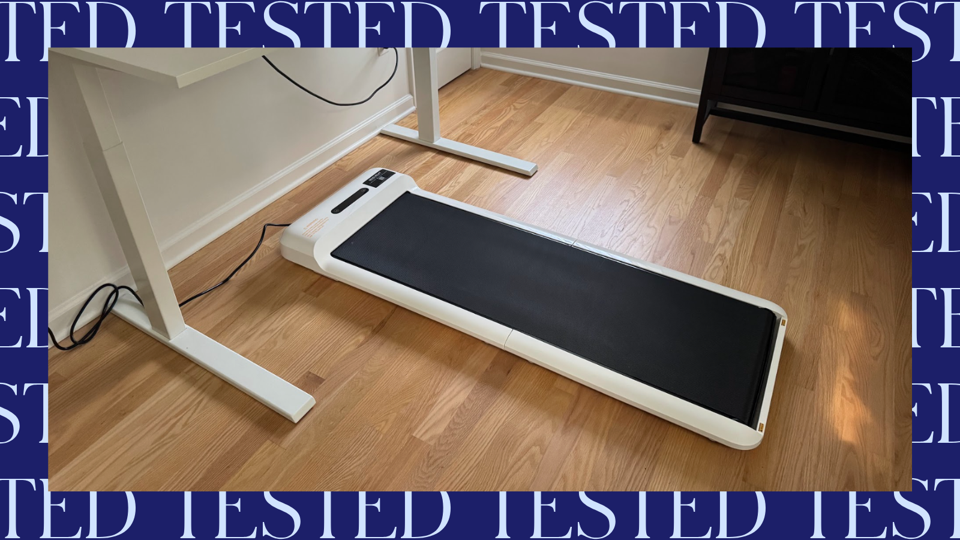 The WalkingPad C2 under a standing desk.