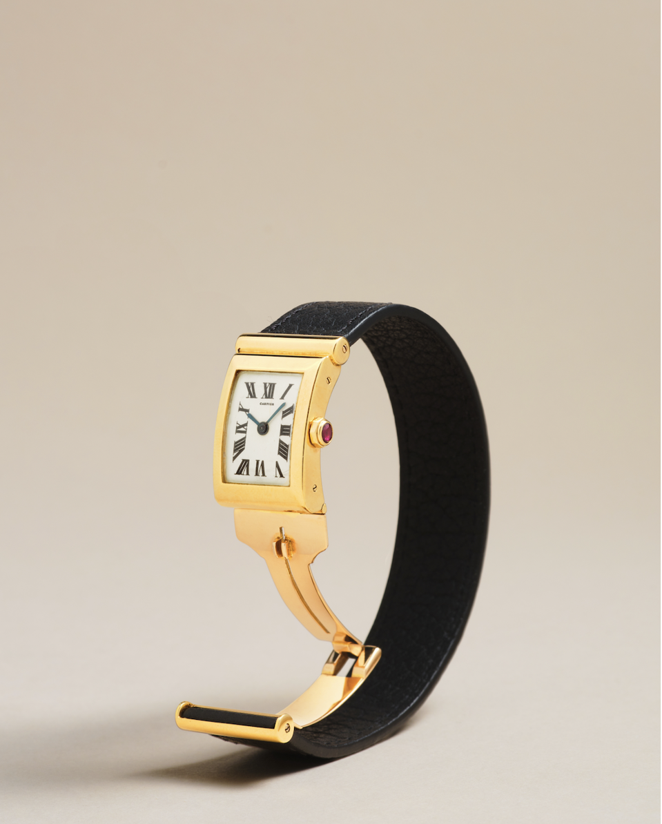 Cartier Driver’s, London, gold deeply curved rectangular watch. Estimate: $50,000-$80,000