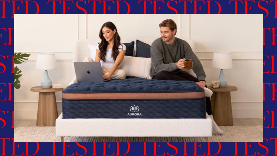 Two people sitting on the Brooklyn Bedding Aurora Luxe Mattress.
