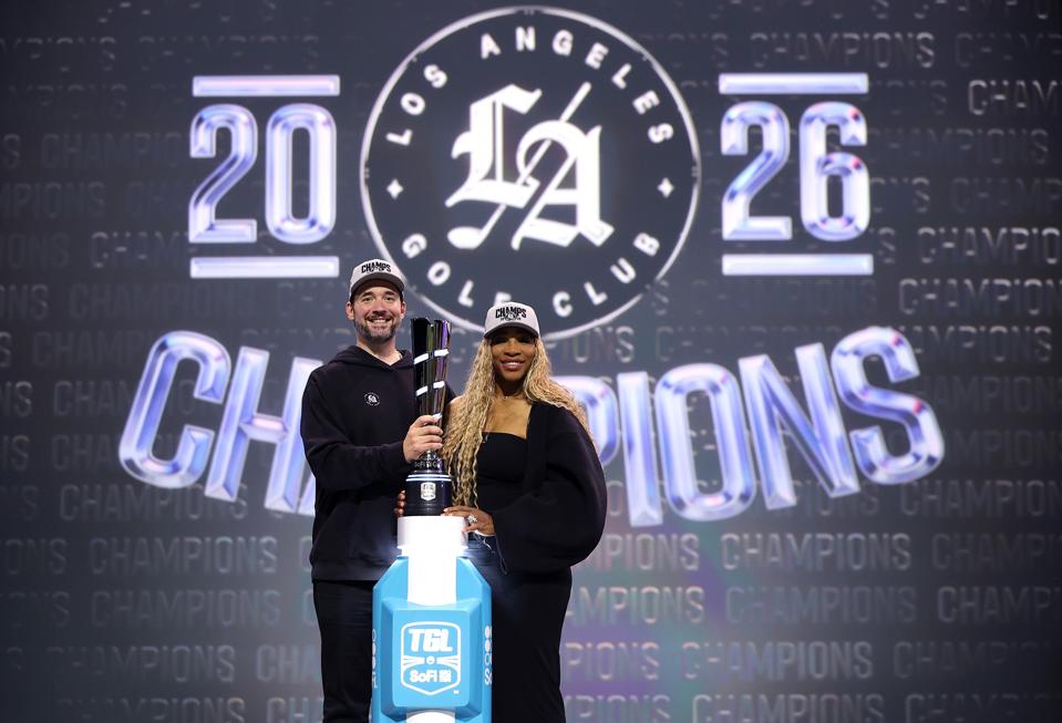 Serena Williams and her husband, Alexis Ohanian, with the TGL trophy after LAGC's win.