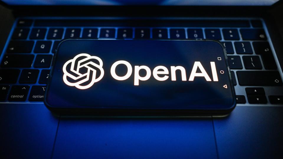 In this photo illustration, an OpenAI logo is seen displayed