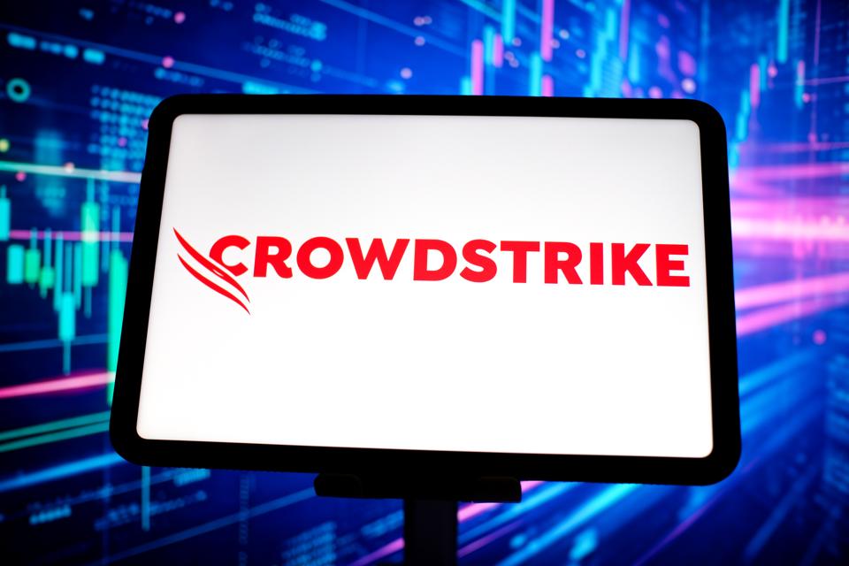 In this photo illustration, the logo of CrowdStrike Holdings