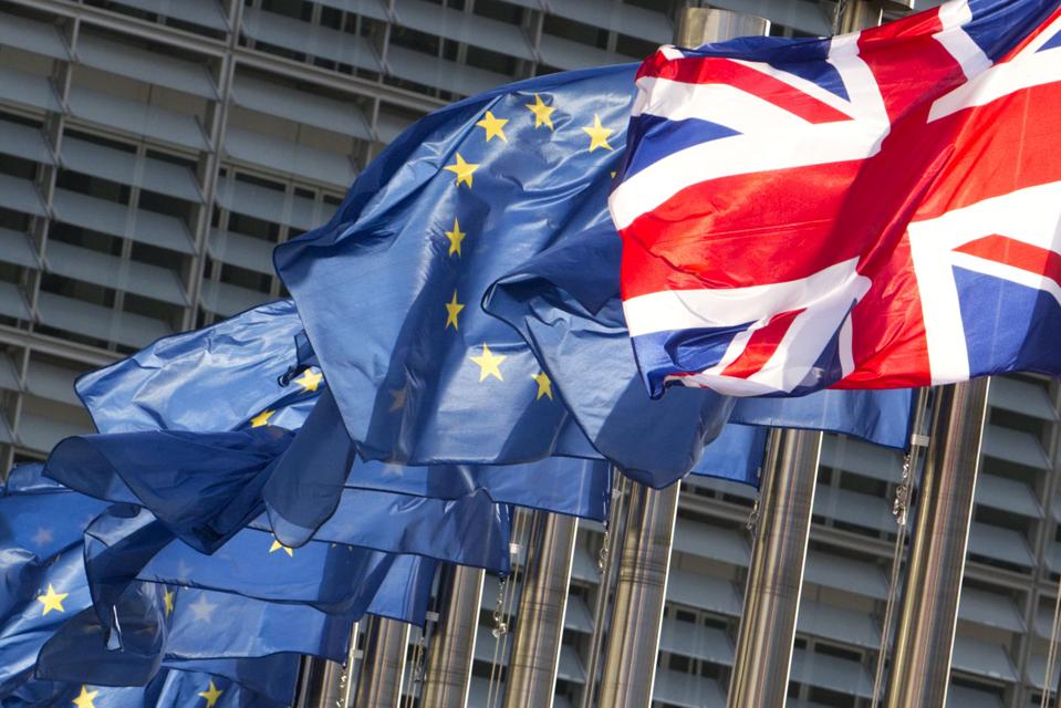 European Union flags and the U.K. flag in the wind. AP Photo/Virginia Mayo