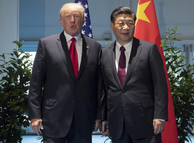 As Trump prepares for visit to Asia and China's Xi, U.S. increasingly finds itself behind a wall