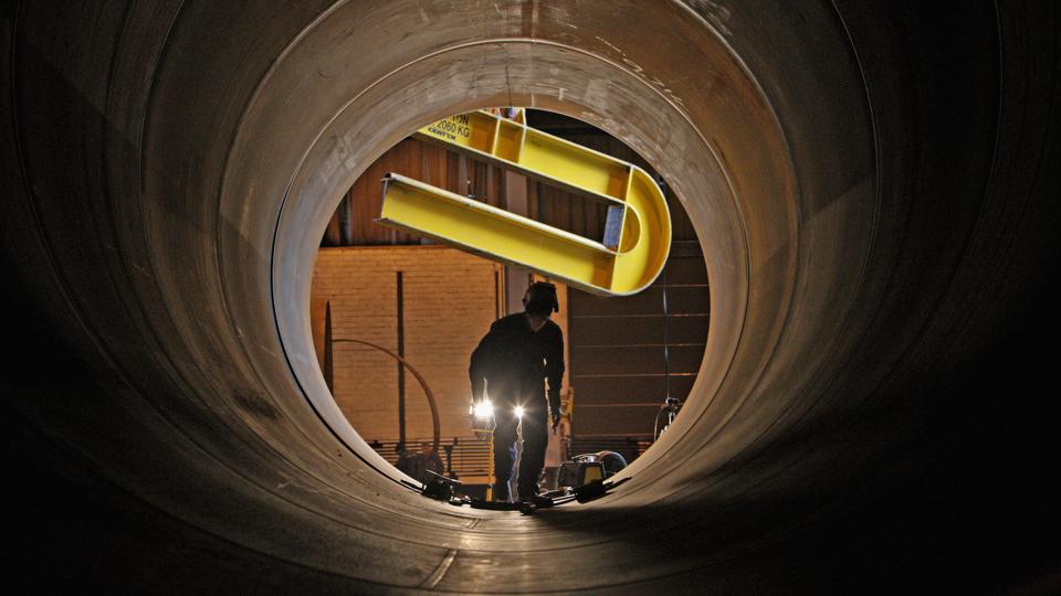 Welders work on sections of a wind turbine at the Skykon factory in Campbeltown, Scotland.
