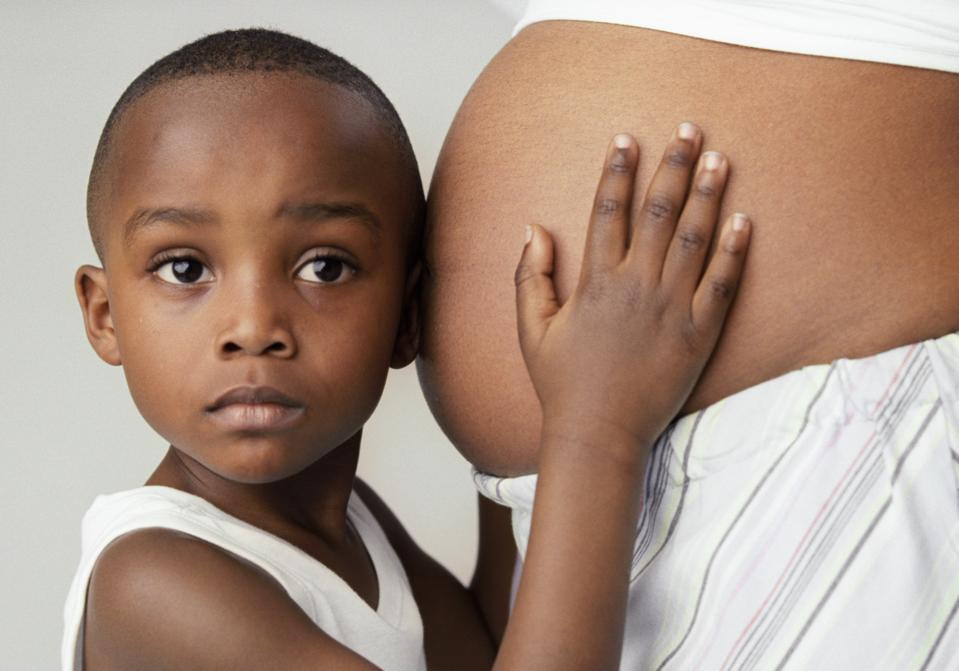 Pregnant woman and son