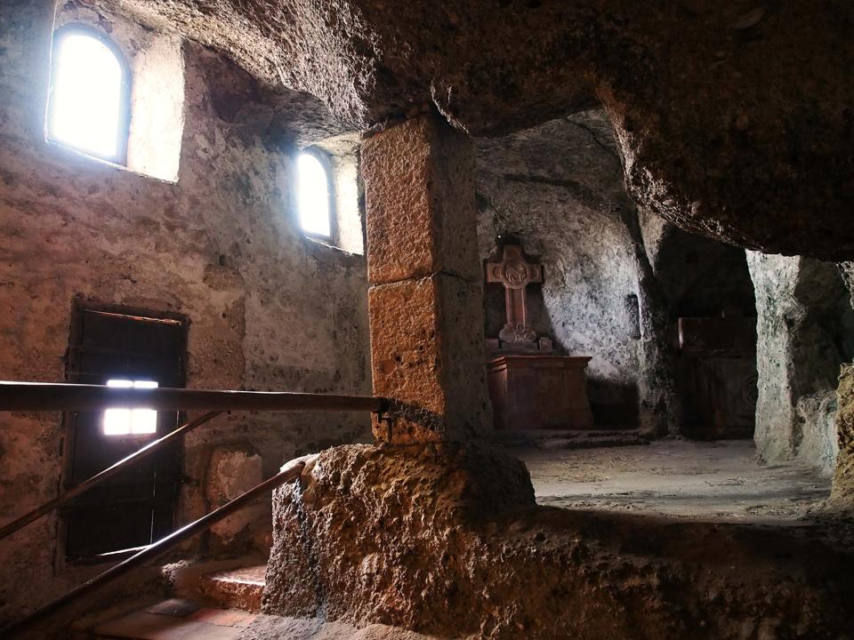 Interior view, showing altar, cross and banks of a 12th...