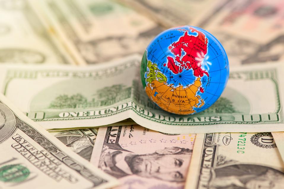 Globe map over many american dollar banknotes