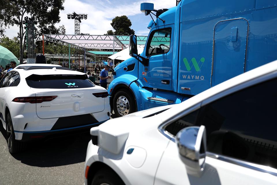 Three of the self-driving vehicles in Waymo's test fleet parked at Google's I/O Developers Conference in Mountain View, California in 2018.
