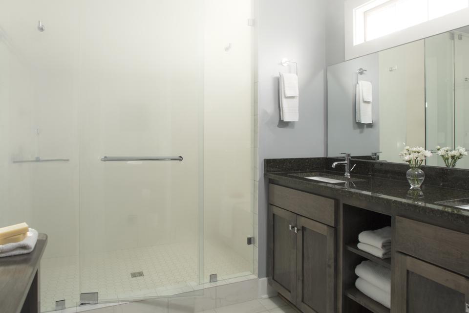 Tiled Modern Bathroom with Glass Shower Doors and steam shower