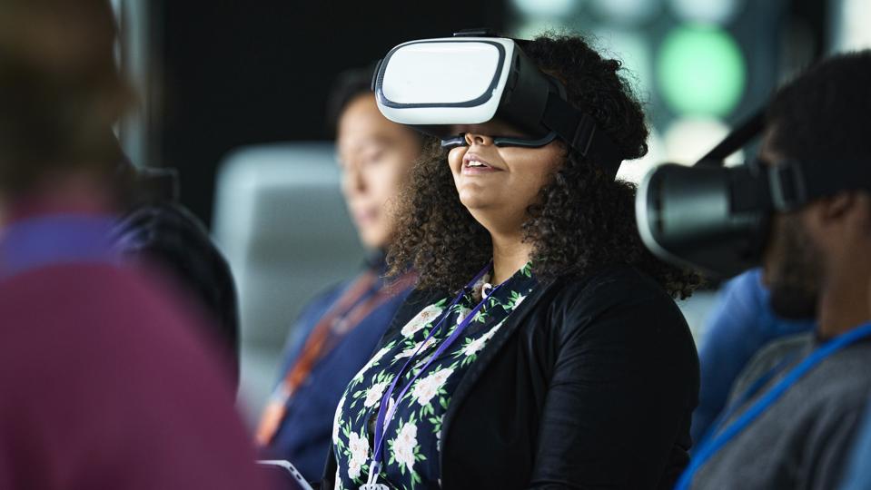 Woman with VR glasses at conference