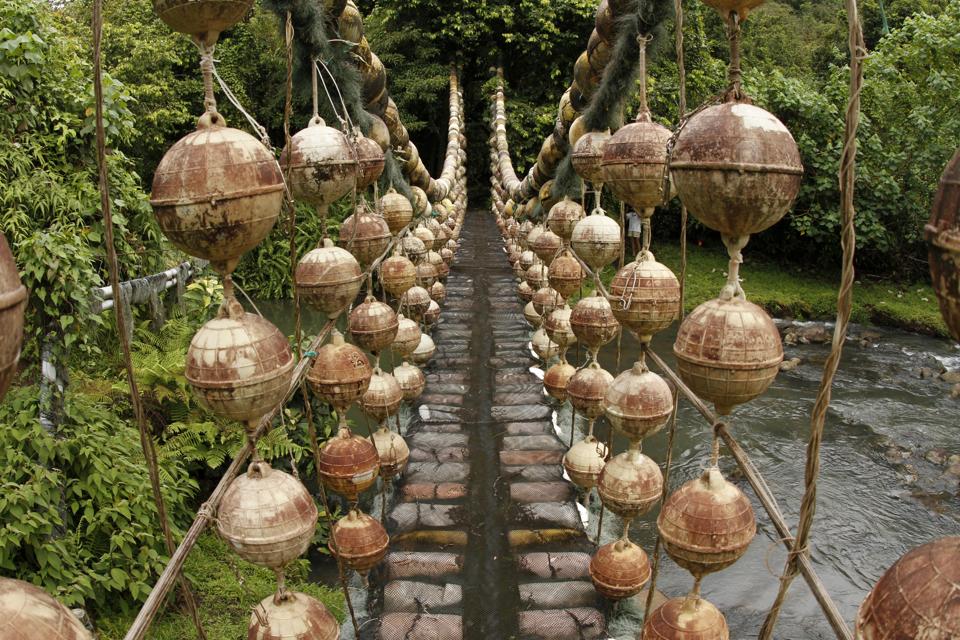 Suspension bridge made from ship buoys and ropes on Cocos Island