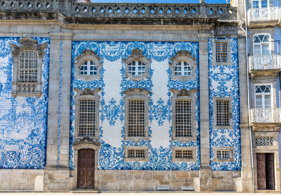 Traditional historic facade in Porto decorated with blue hand painted tin-glazed tiles, Oporto, Portugal